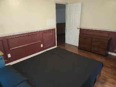 Furnished bedroom with utilities