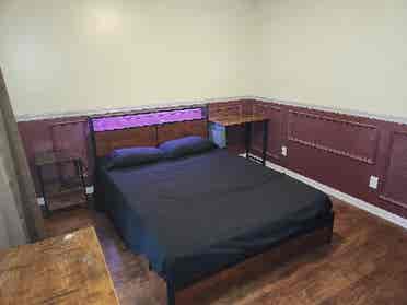 Furnished bedroom with utilities