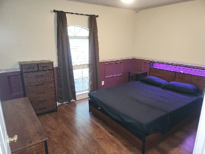 Furnished bedroom with utilities