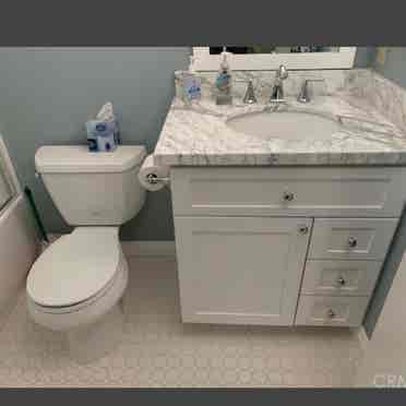 Large room with attached bathroom.