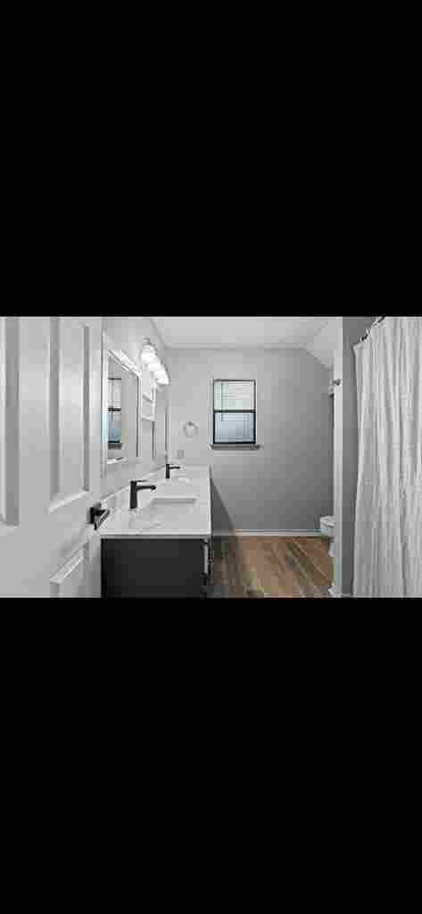 Furnished bedroom with queen bed