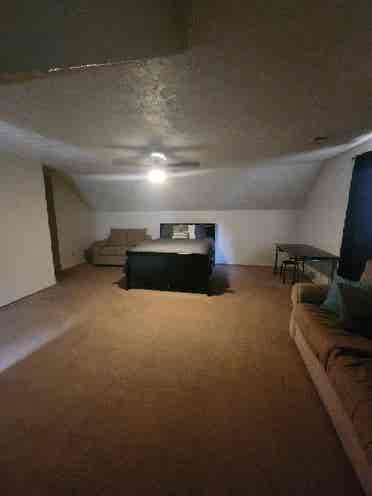 Large upstairs room in house.