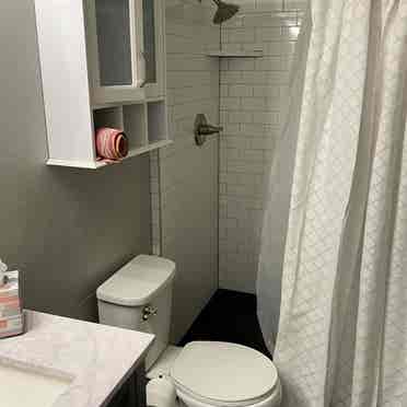 Basement studio furnished private washer and dryer private refrigerator shared entrance. This includes a kitchenette.