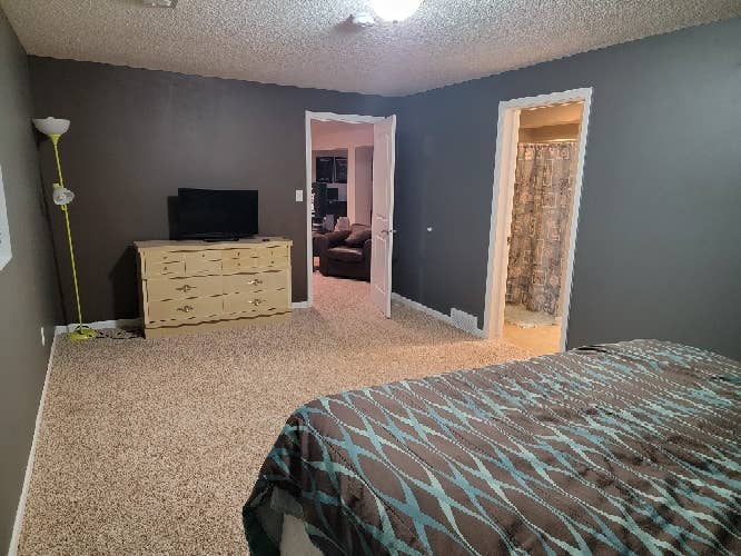 Room in large home with large yard.