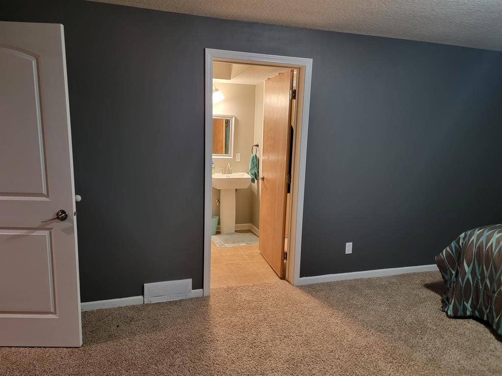 Room in large home with large yard.