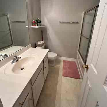 Private bedroom with a shared bath