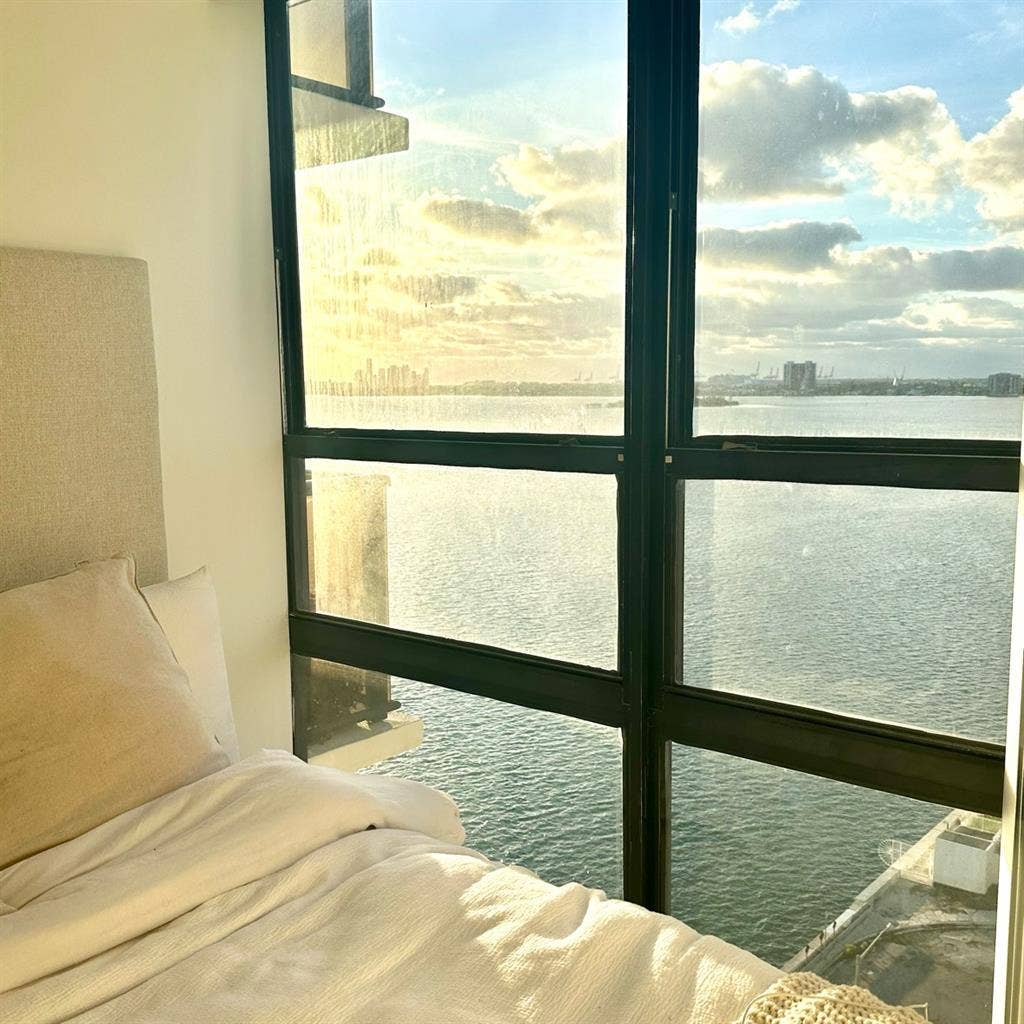 Unfurnished bedroom with water view