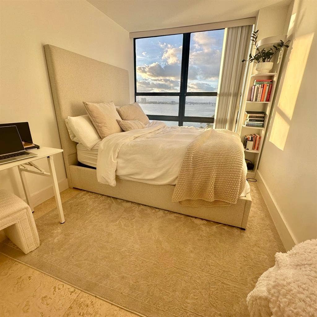 Unfurnished bedroom with water view