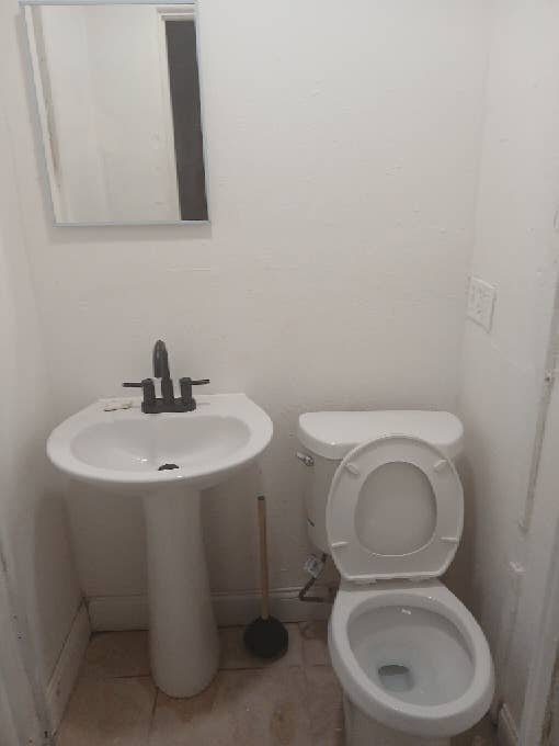 Small room with open half bath.