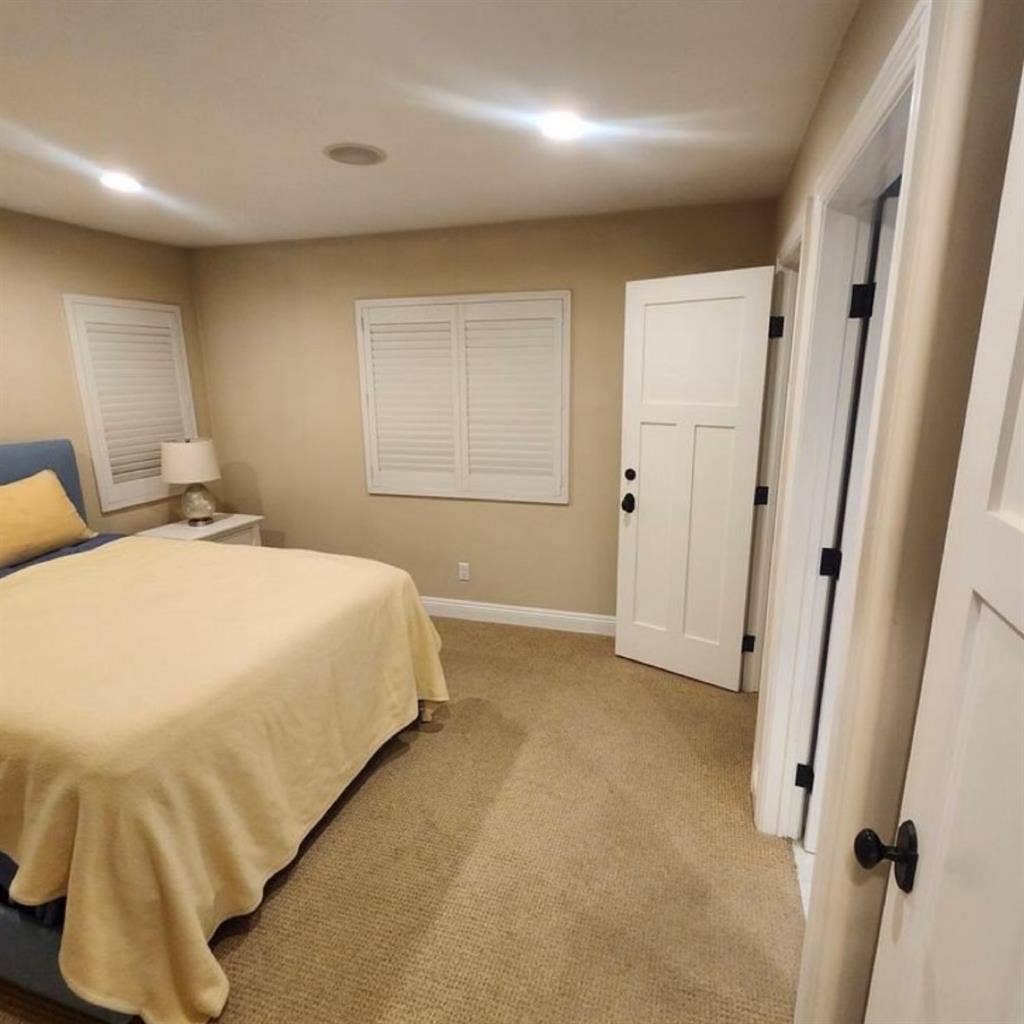 A large master bedroom, furnished