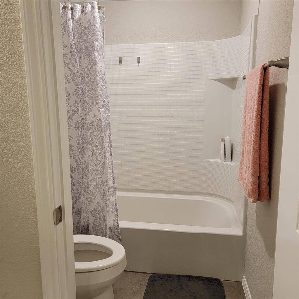 Bedroom with shared full bathroom
