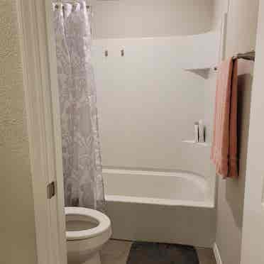 Bedroom with shared full bathroom