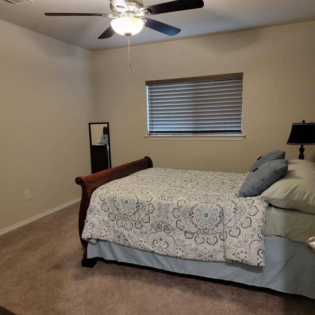 Bedroom with shared full bathroom