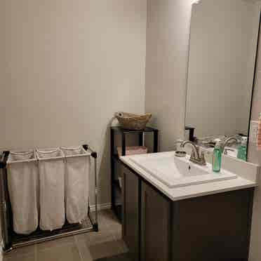 Bedroom with shared full bathroom