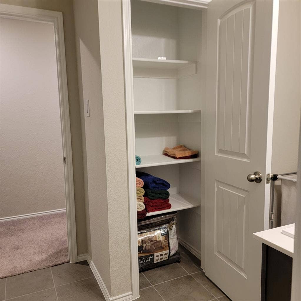 Bedroom with shared full bathroom