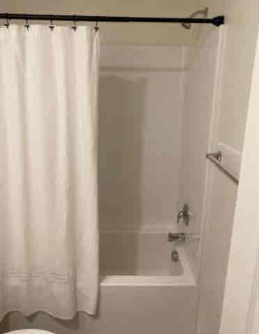 Bedroom for rent sharing bath.