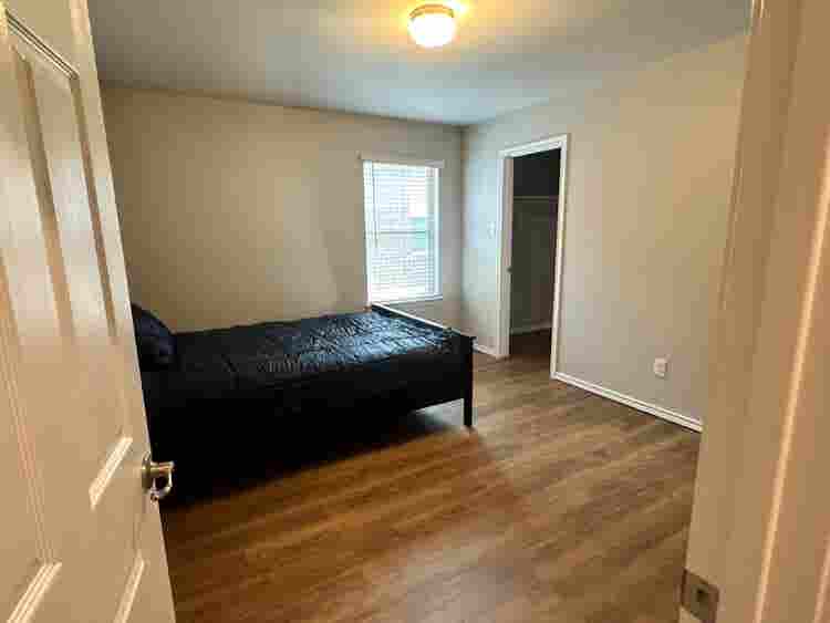 Furnished Bedroom w/ walk-in closet