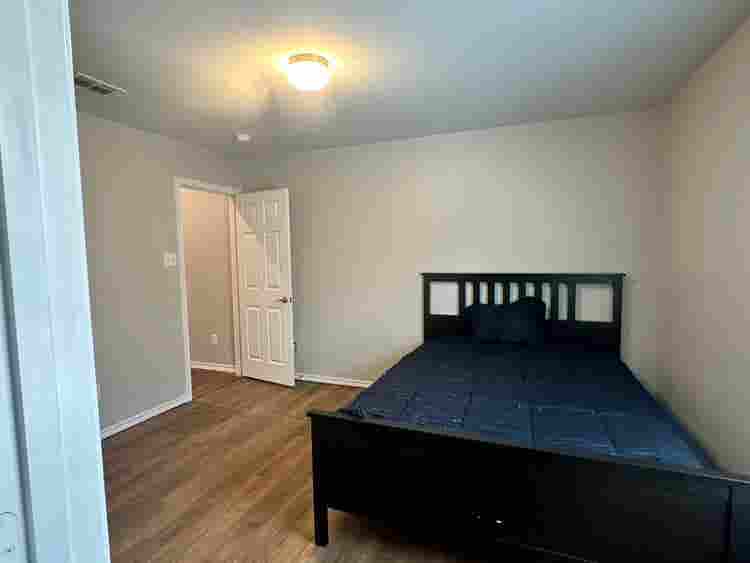 Furnished Bedroom w/ walk-in closet