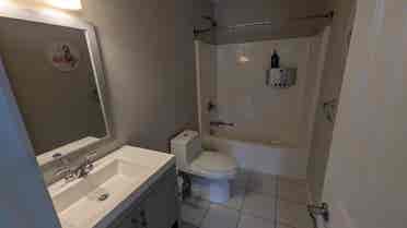 Room with private attached bathroom