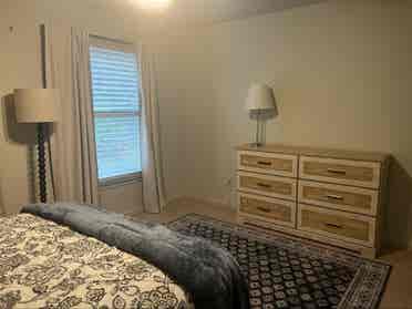 Furnished bedroom with queen bed
