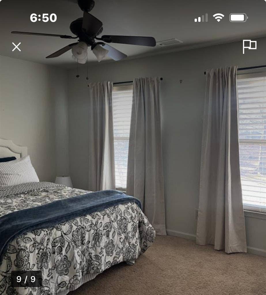 Furnished bedroom with queen bed