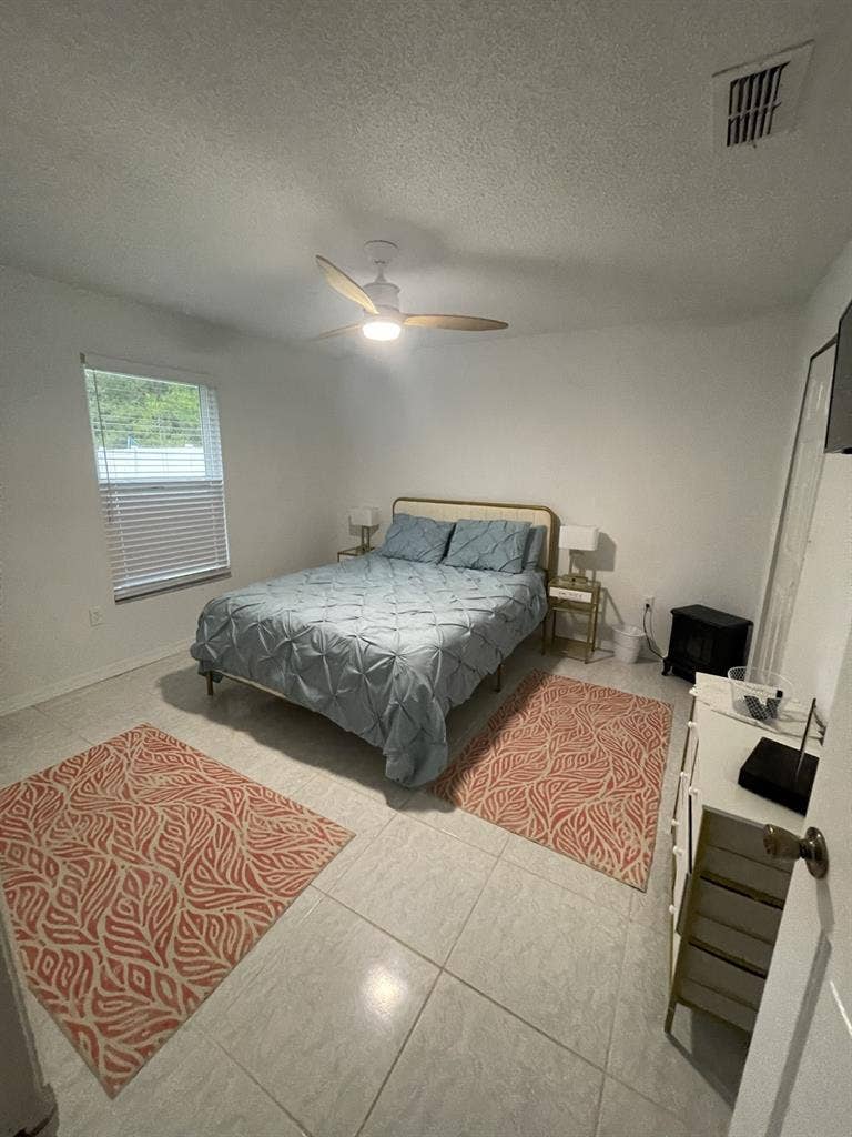 Furnished bedroom with private bath