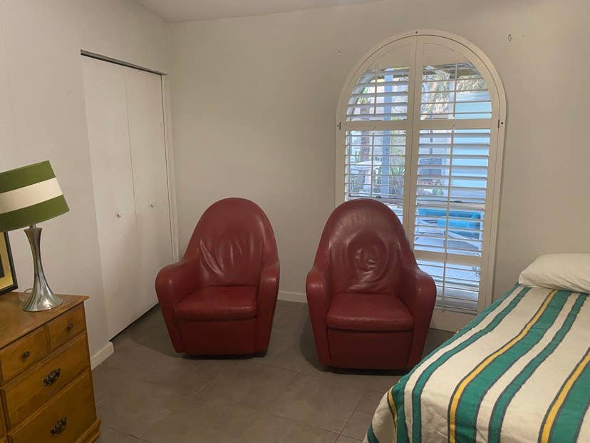 Large room in house with pool.
