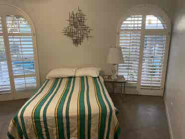 Large room in house with pool.