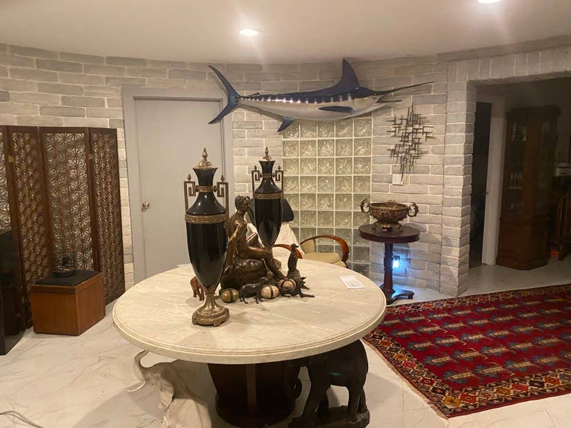 Large room in house with pool.