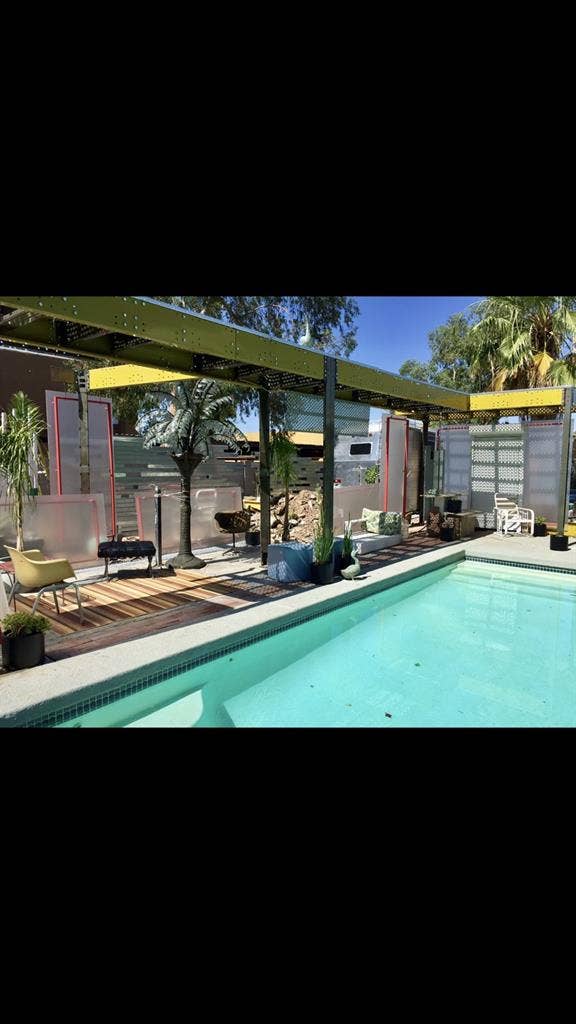 Large room in house with pool.