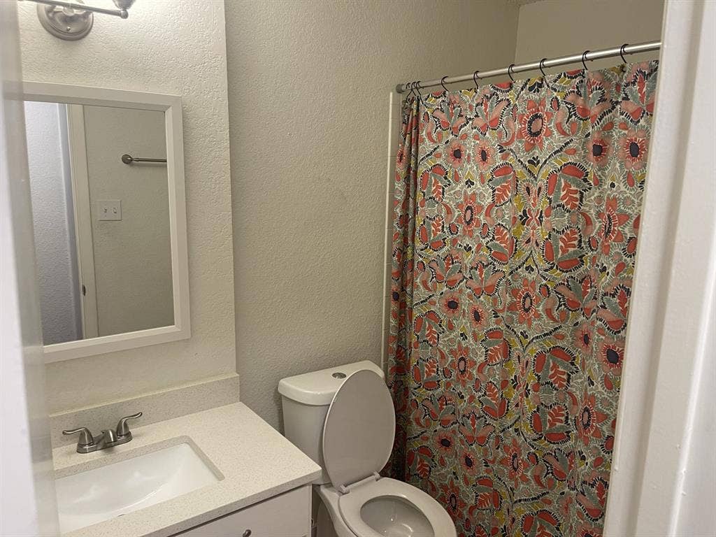Room and bathroom with parking