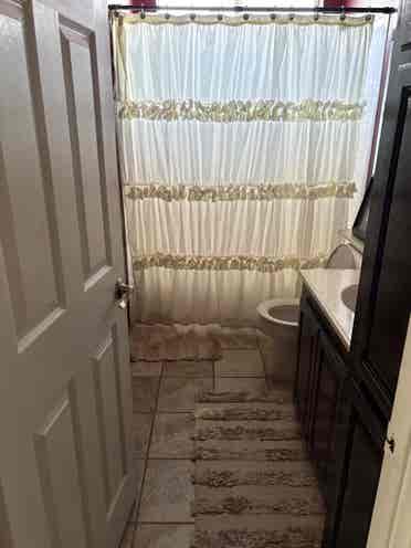 Larger bedroom shared bathroom