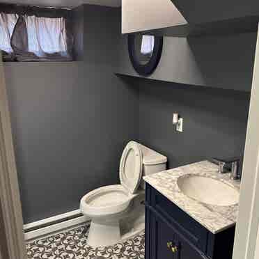 Downstairs room w/ private bathroom