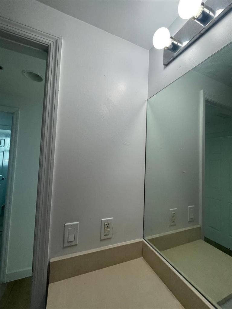 Room with balcony and bathroom