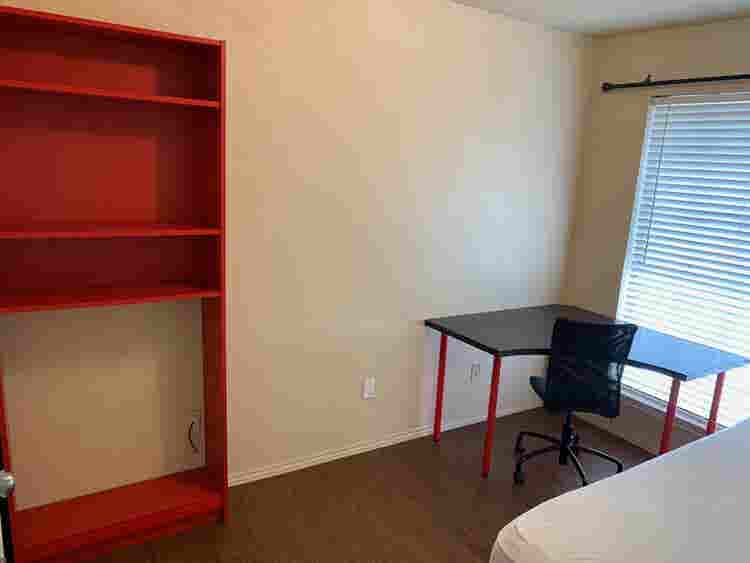 Bedroom in a house with bills paid