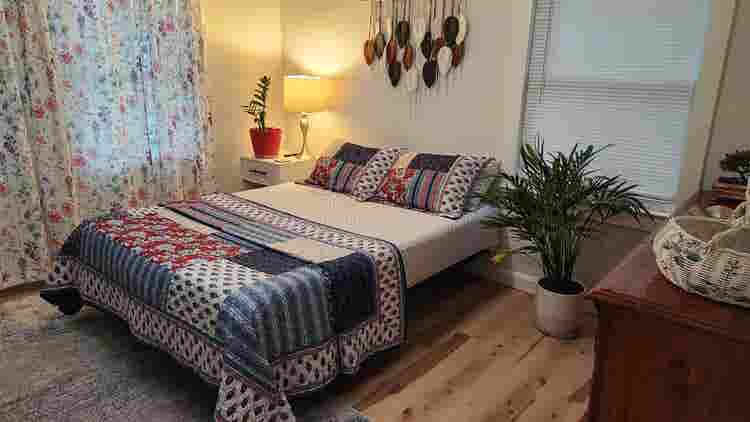 A cozy garden-view bedroom