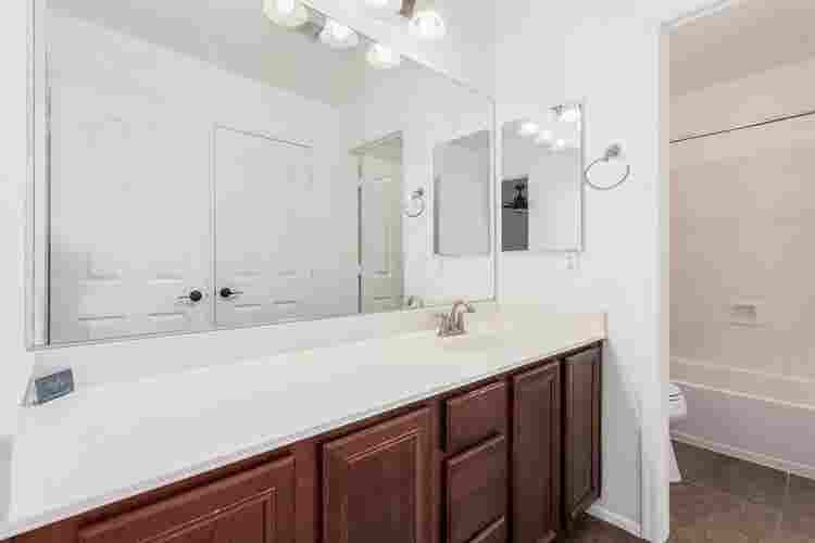 Two story with rooms for rent.