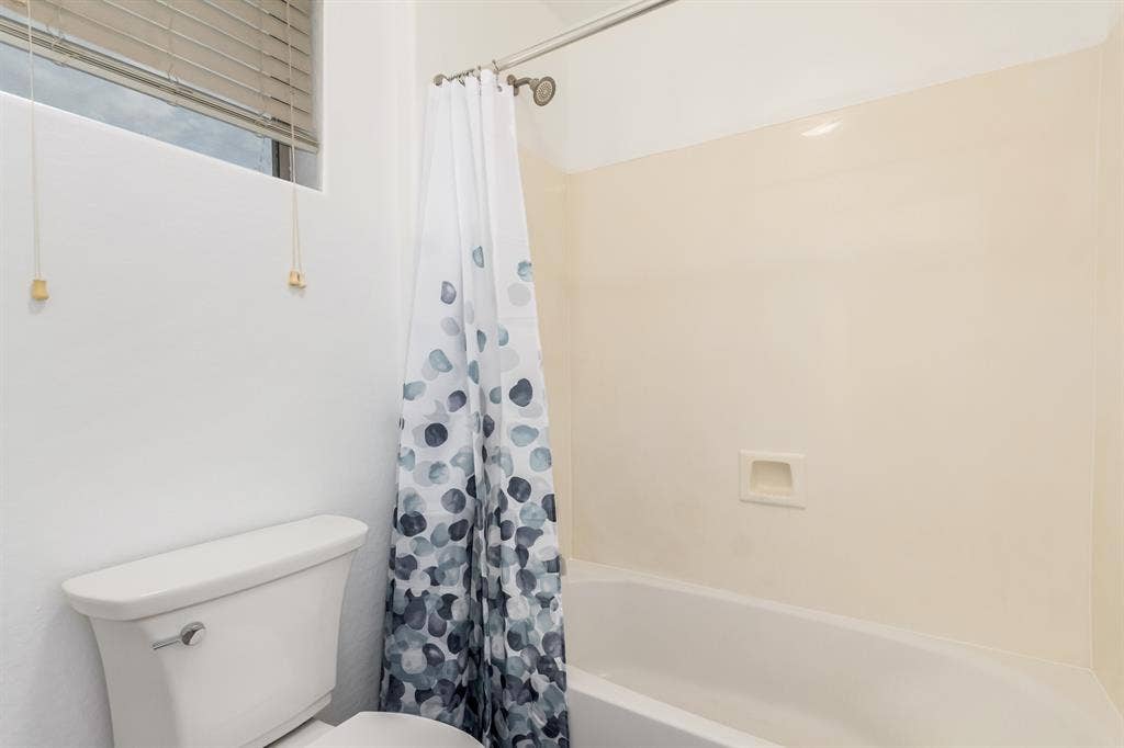 Two story with rooms for rent.