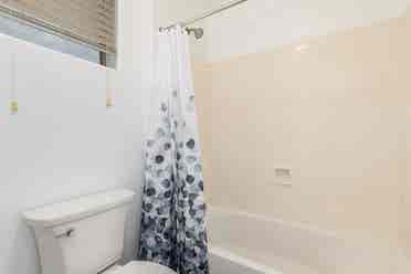 Two story with rooms for rent.