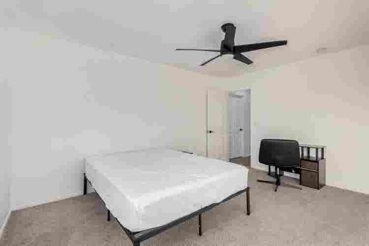 Two story with rooms for rent.