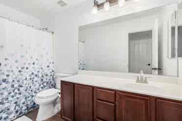Two story with rooms for rent.