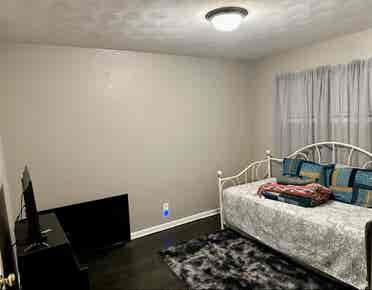 Bedroom and bathroom in home.