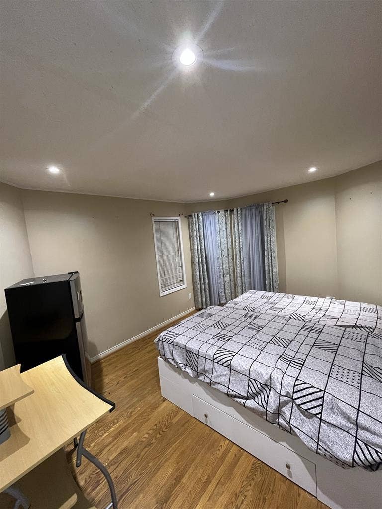 Large bedroom with two single beds.