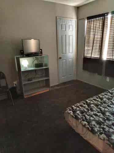 A Room w/ Bed, TV and Closet