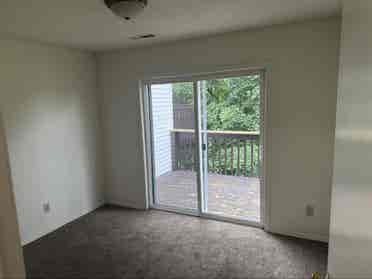 Unfurnished bedroom with balcony