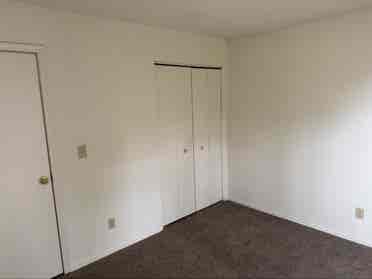 Unfurnished bedroom with balcony