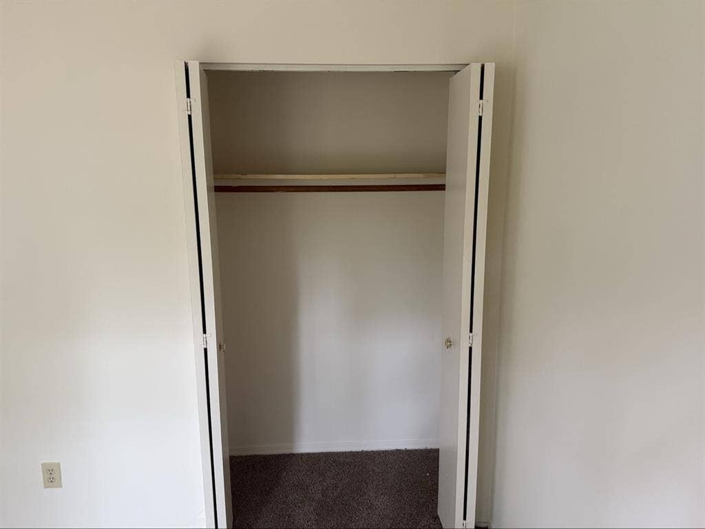 Unfurnished bedroom with balcony