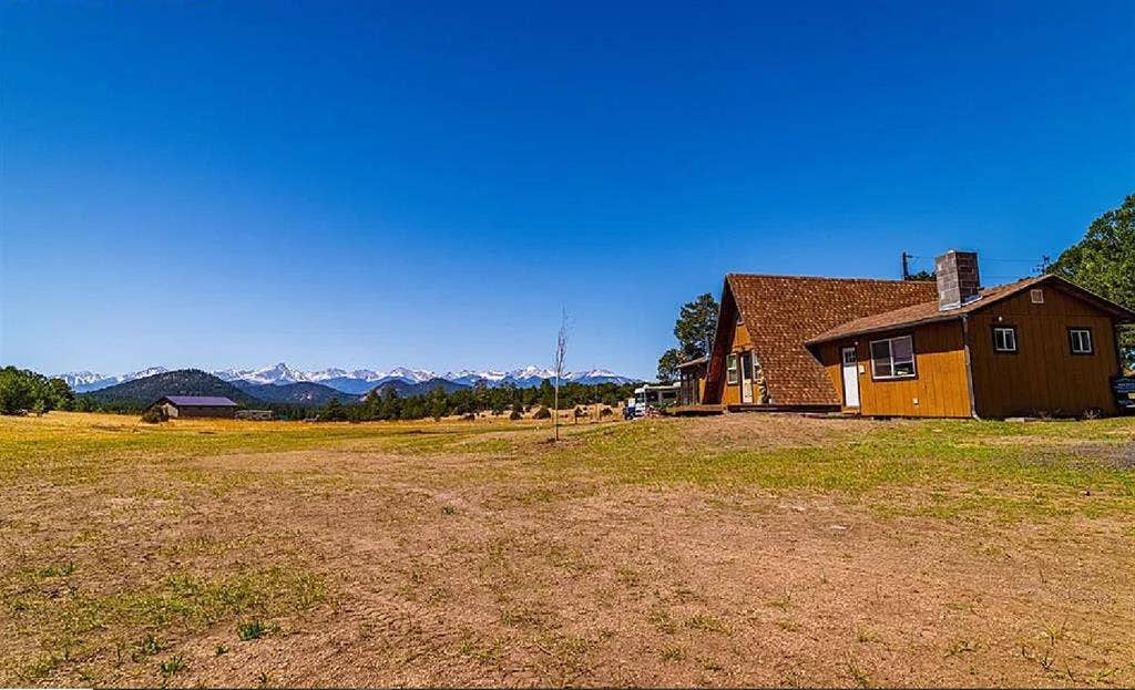 Rural home between forested hills