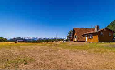 Rural home between forested hills