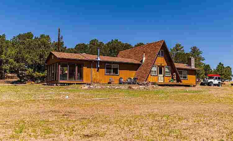 Rural home between forested hills